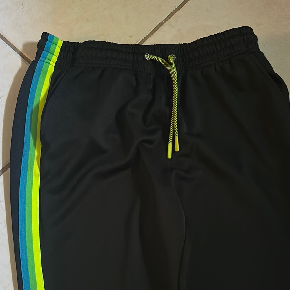 Navy Blue Psycho Bunny joggers with neon stripes on sides